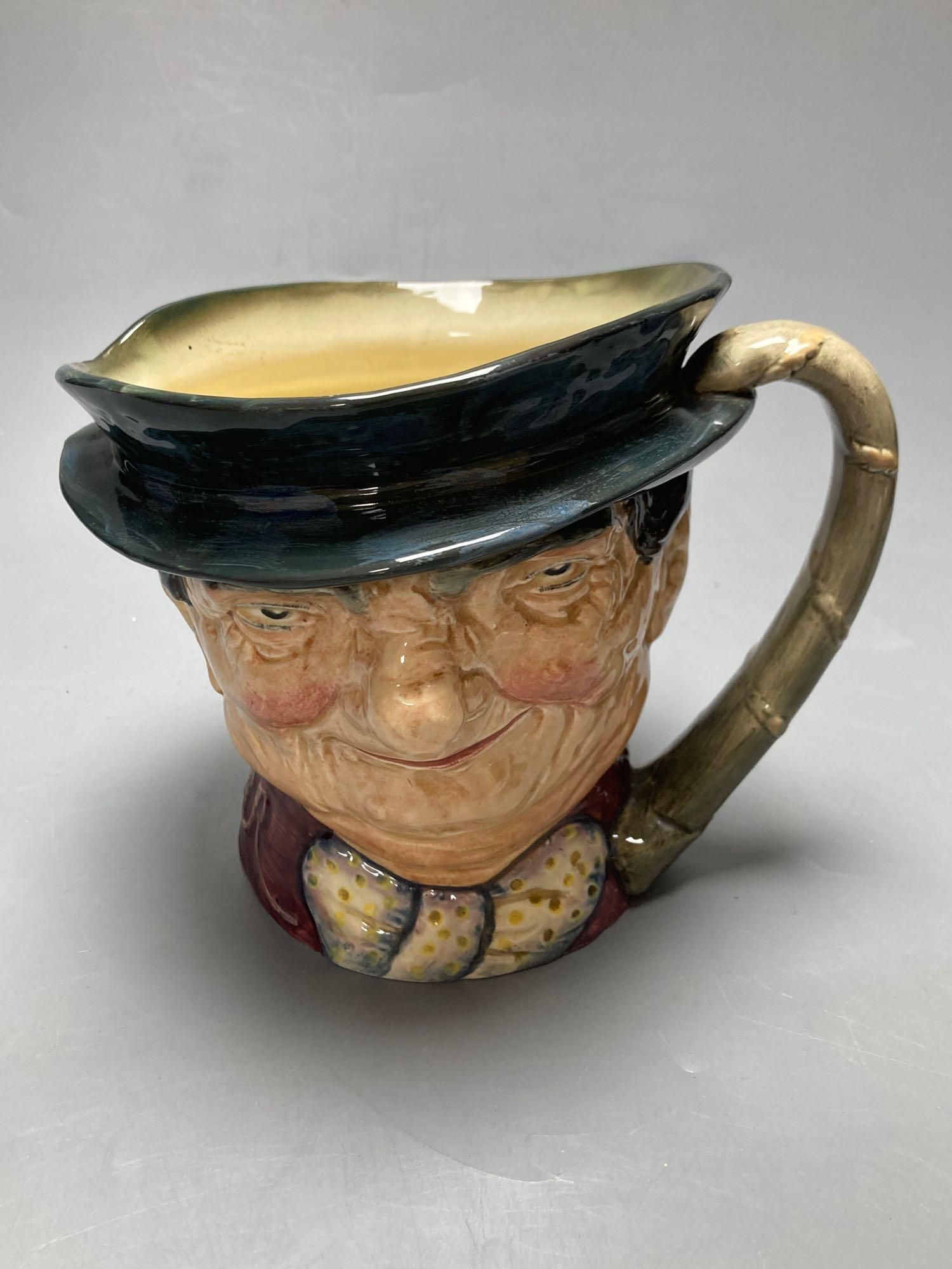 A Royal Doulton Ugly Duchess character jug, Royal Doulton Tony Weller musical character jug and Royal Doulton Old Charley ashtray